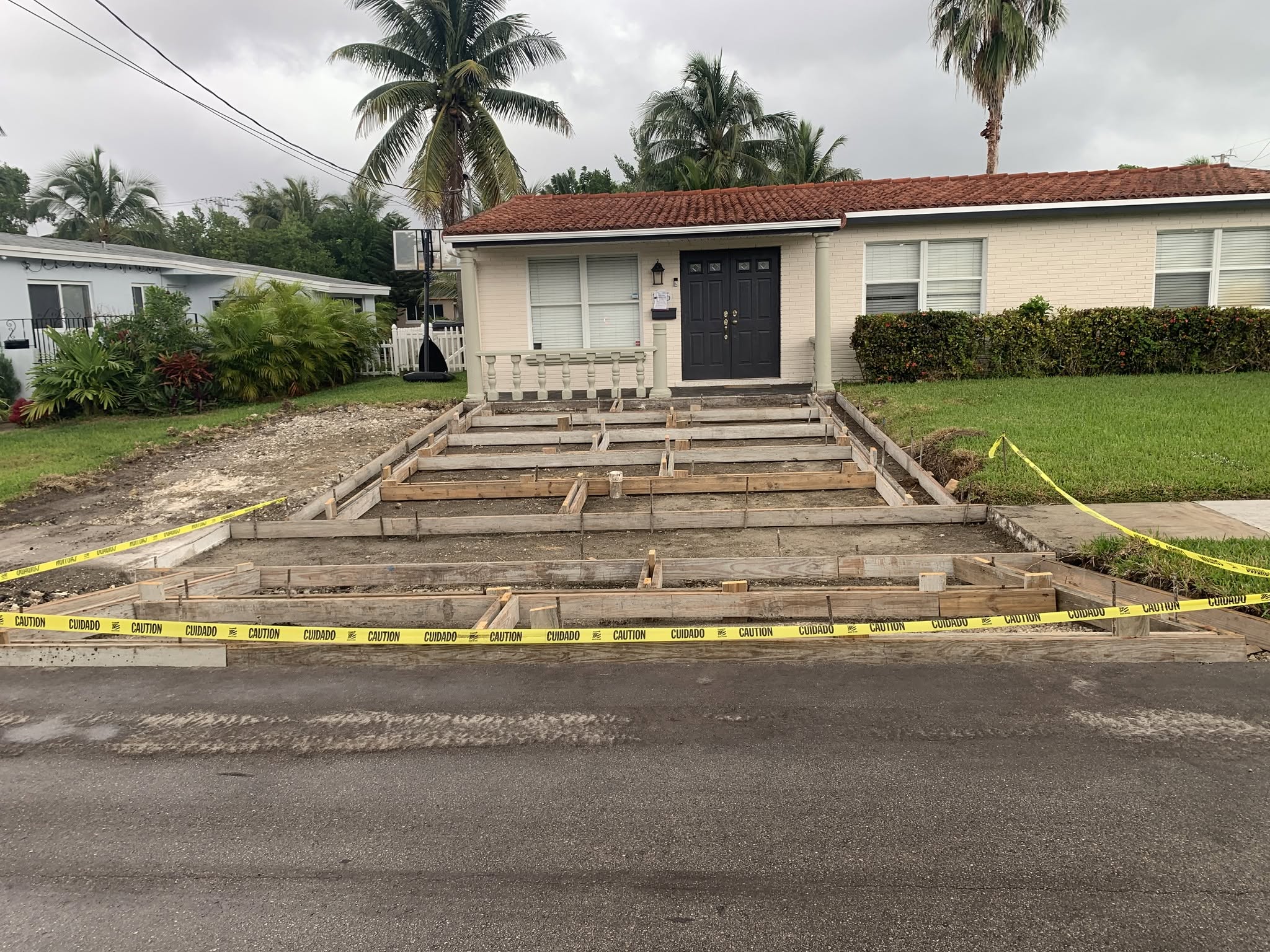 Timber forms outline the driveway sections before concrete placement.